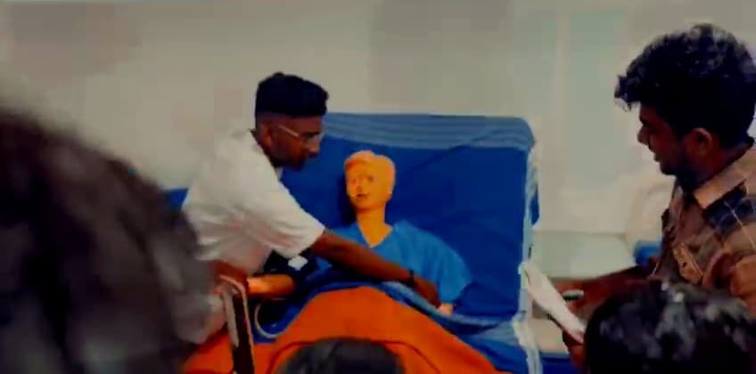 Students practising maternal and child health care on a simulator